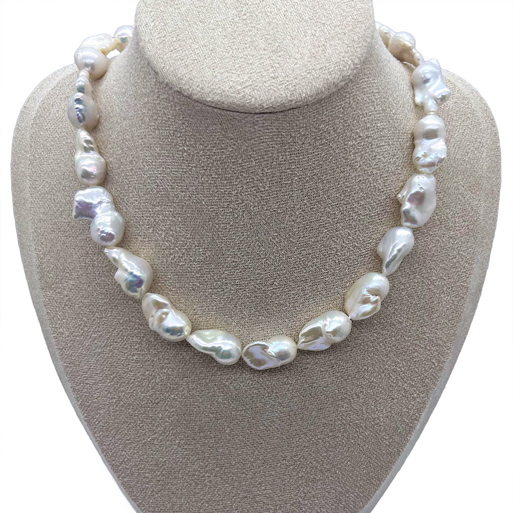 12-14mm Multicolored Fishtail-Shaped Freshwater Necklace showcased on a khaki jewelry display stand.