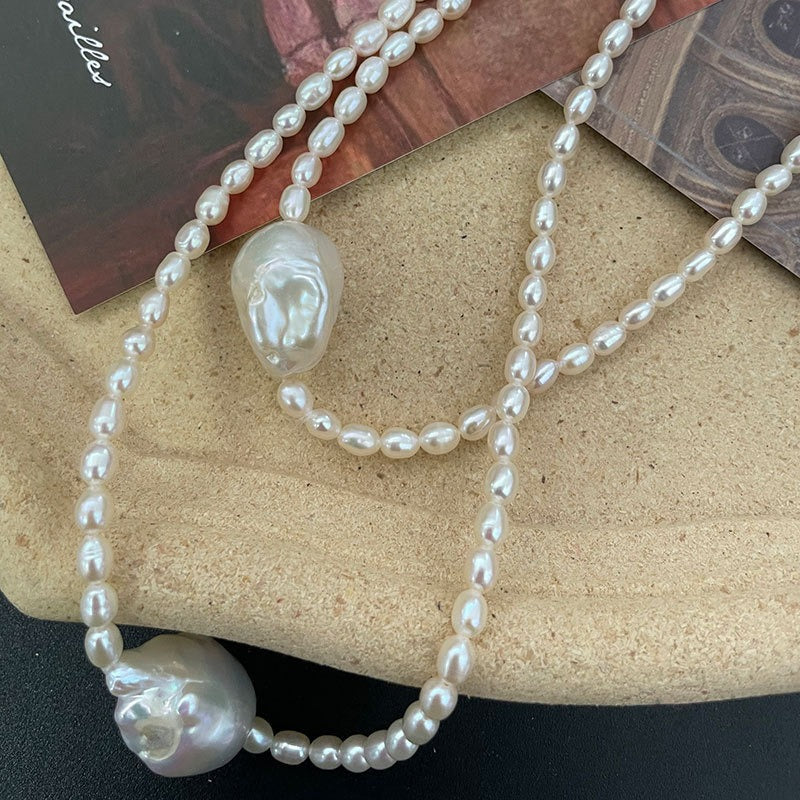 Close-up display of the Baroque Pearl Pendant on an Oval Pearl Necklace.