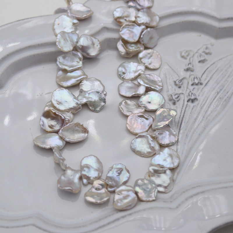 11-14mm petal-shaped Keshi pearl necklace exhibiting an enchanting radiance.