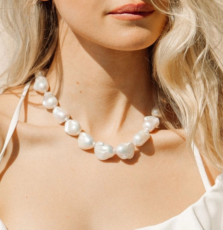 A blonde model wearing the 12-14mm Multicolored Fishtail-Shaped Freshwater Necklace.