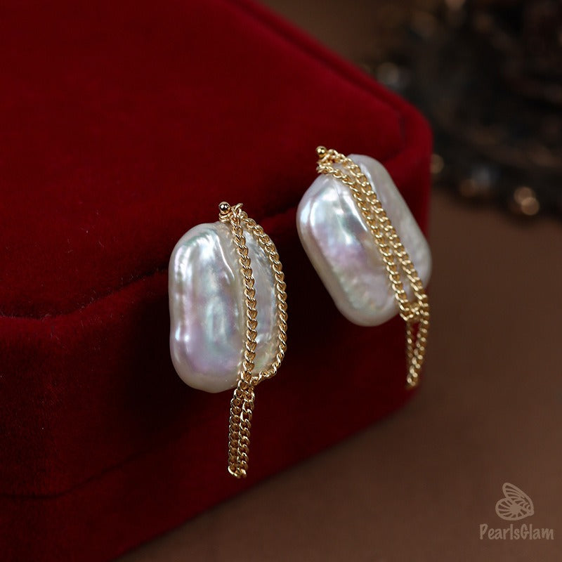 Pearl earrings with gold chains 