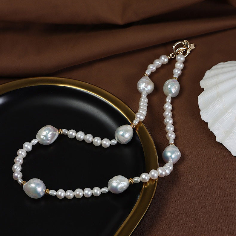 5-6mm Coin-shaped Stacked Hole Keshi Pearl Necklace displaying a style of classicism, elegance, and individuality.