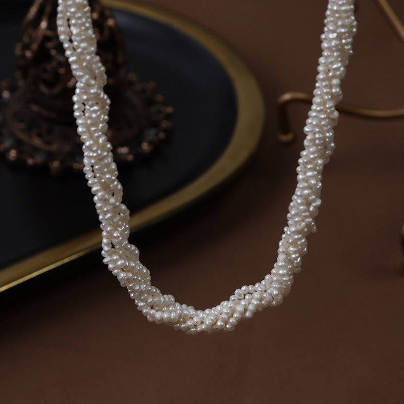 Close-up display of the Baby Freshwater Pearls Twisted Chain Necklace