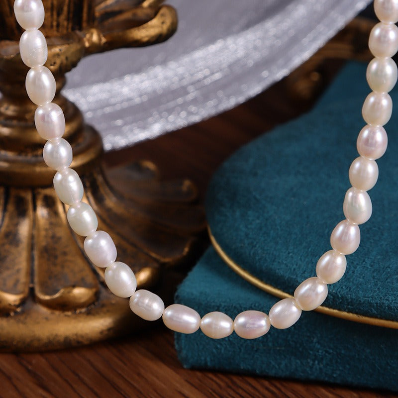 Detail showcase of the Oval-shaped Freshwater Pearls in the Flat Keshi and Oval Pearl Strung Necklace.