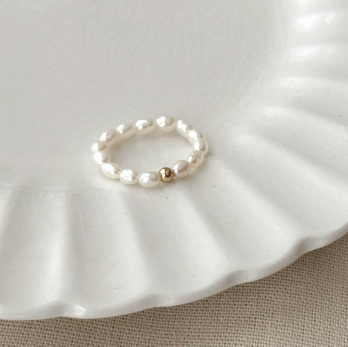 Freshwater Pearl Stretch Ring with goldenball showcases a elegant style