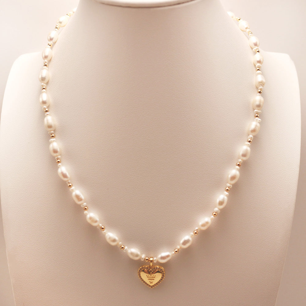 Heart-Shaped Pendant Freshwater Pearl Strand Necklace showcases an elegant style and fashionable design.