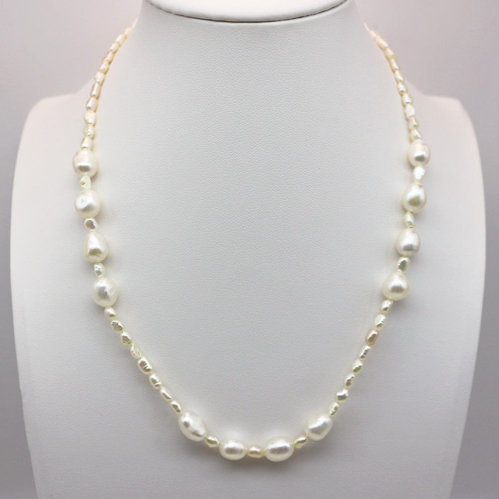 Baroque Pearls Strand Necklace displayed under cool-toned lighting.