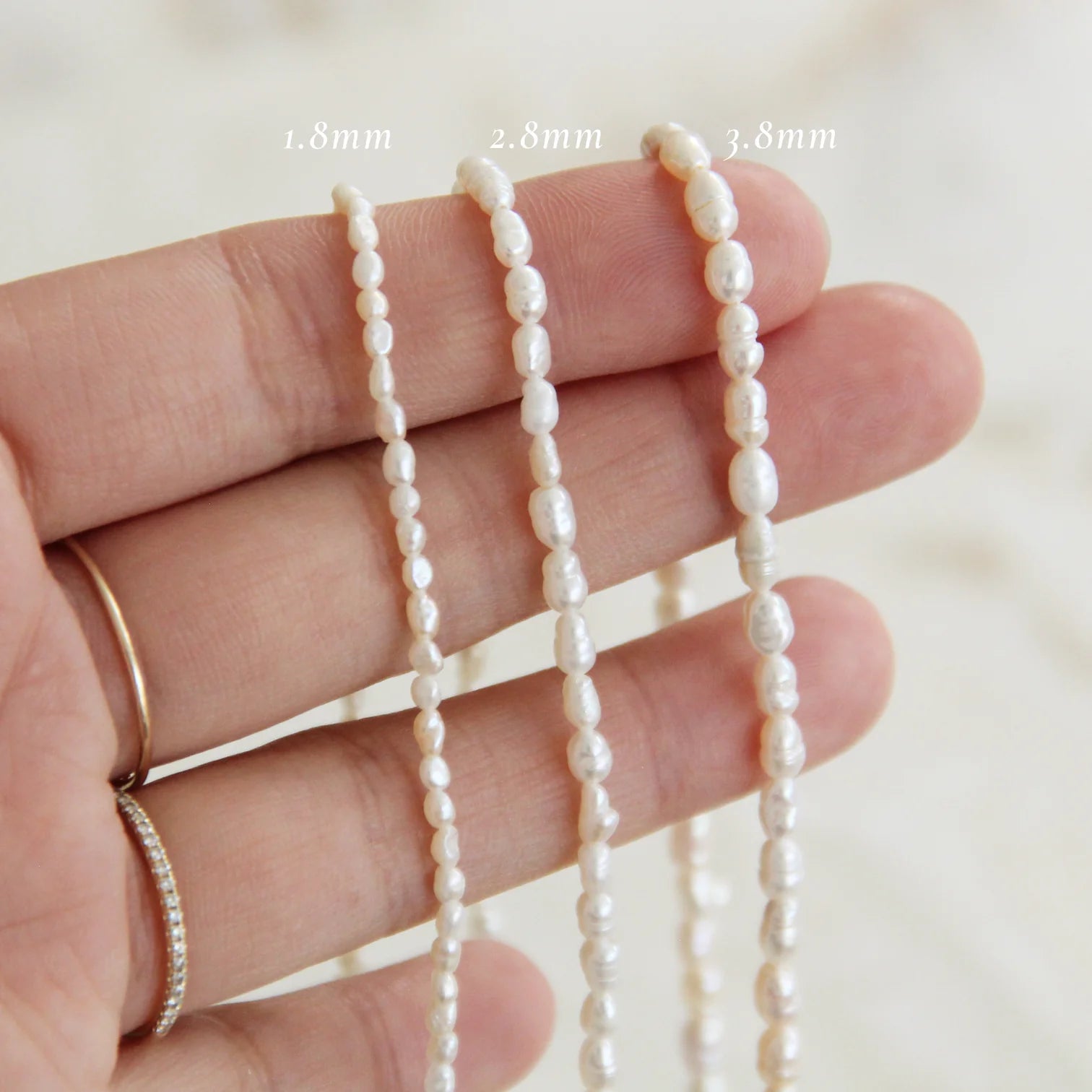 A Size Comparison Among Various Freshwater Pearl Necklaces with Rice Bead Shapes.